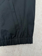 Dark jacket sleeve hem with elastic cuff detail