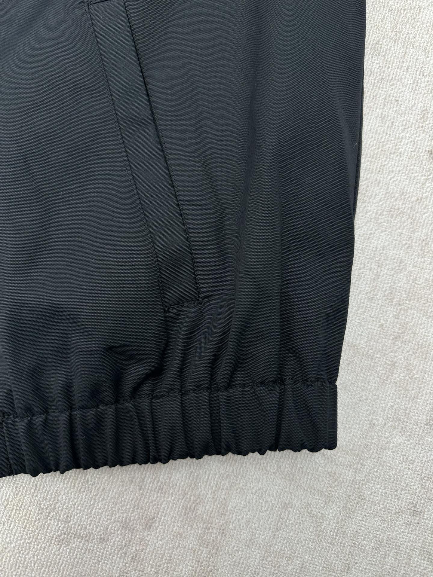 Dark jacket sleeve hem with elastic cuff detail