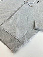 Amiri hoodie close-up showing metal zipper and gray drawcord inside hood