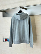 Amiri hoodie in light gray heather, rear view with attached hood