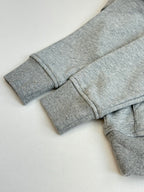 Amiri hoodie cuff and hem close-up with folded sleeve and top stitching seams