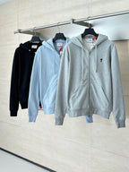 Amiri hoodie set on hangers: light blue and light gray zip-up hoodies