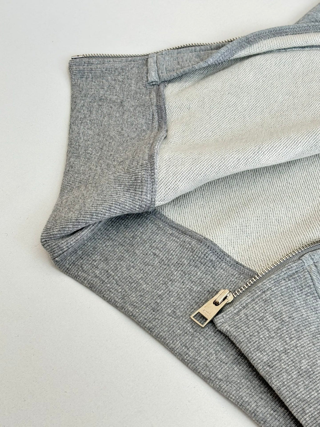 Gray zip-fly sweatpants with metal buckle detail