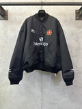 Balenciaga black bomber jacket with button front and crest logo patch