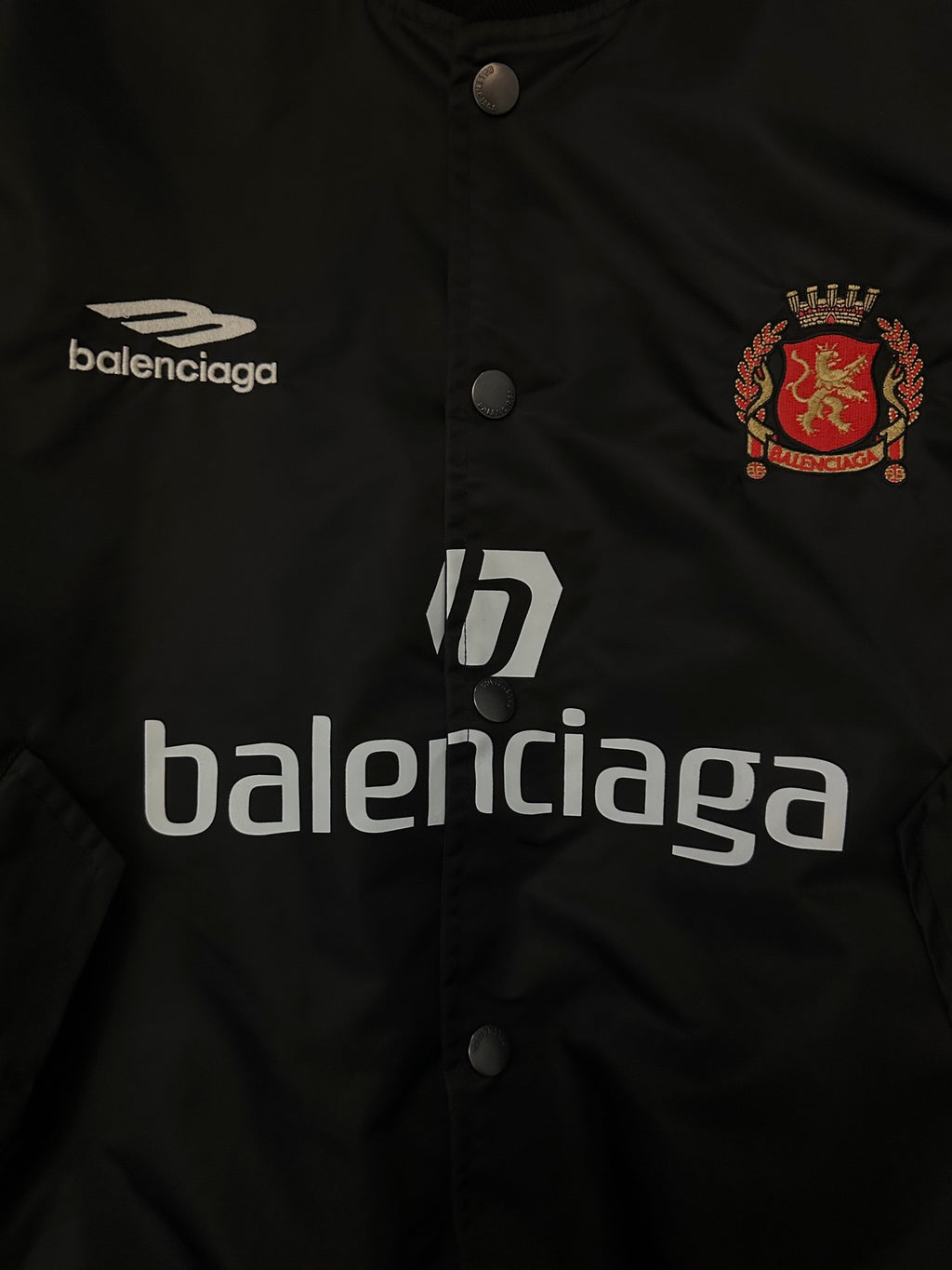 Balenciaga black bomber jacket with crest emblem and Balenciaga lettering