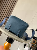Blue Loewe crossbody bag with front logo and buckle flap, adjustable strap