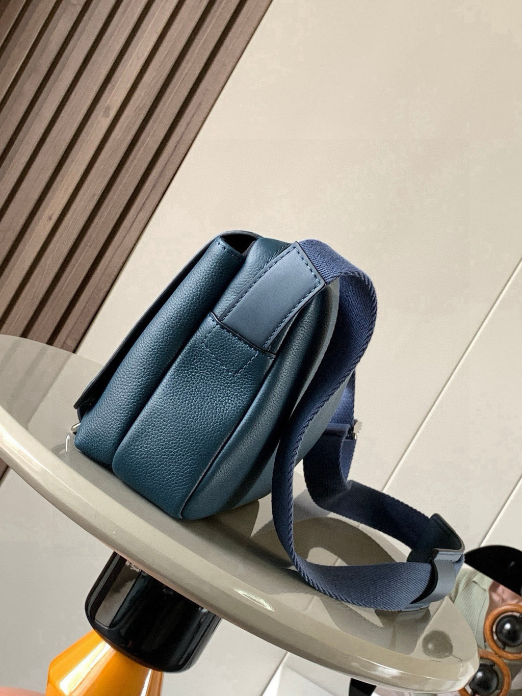 Loewe blue leather crossbody bag side view with adjustable strap