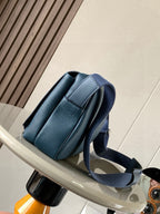 Loewe blue leather crossbody bag side view with adjustable strap