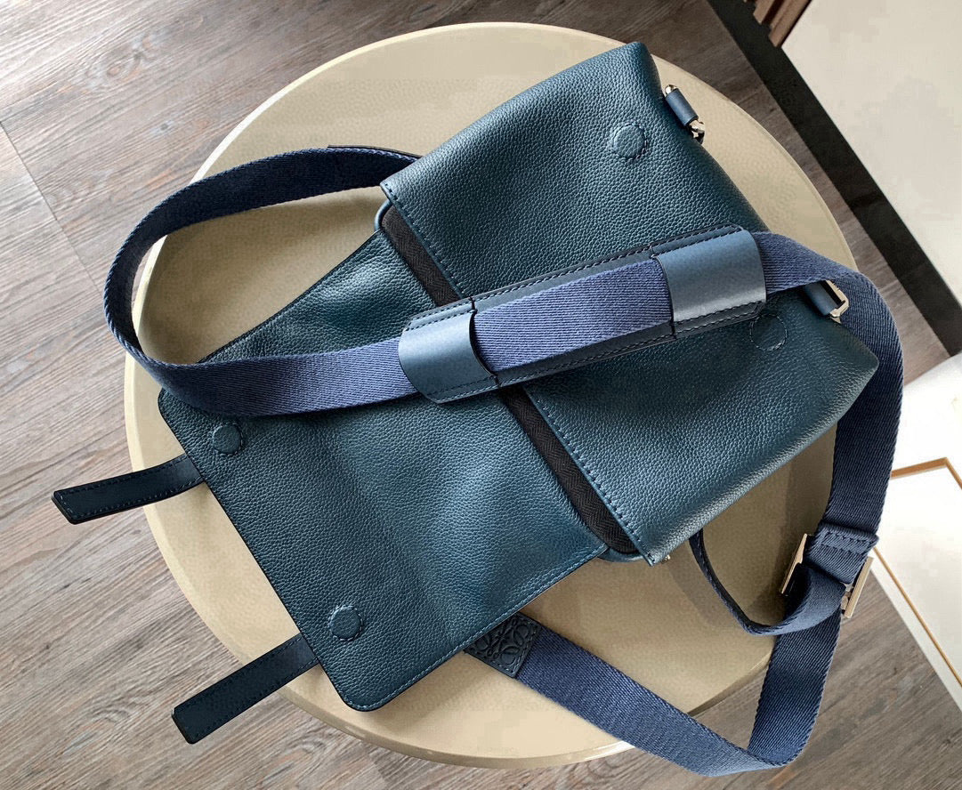 Loewe blue leather crossbody bag back view with strap and buckles