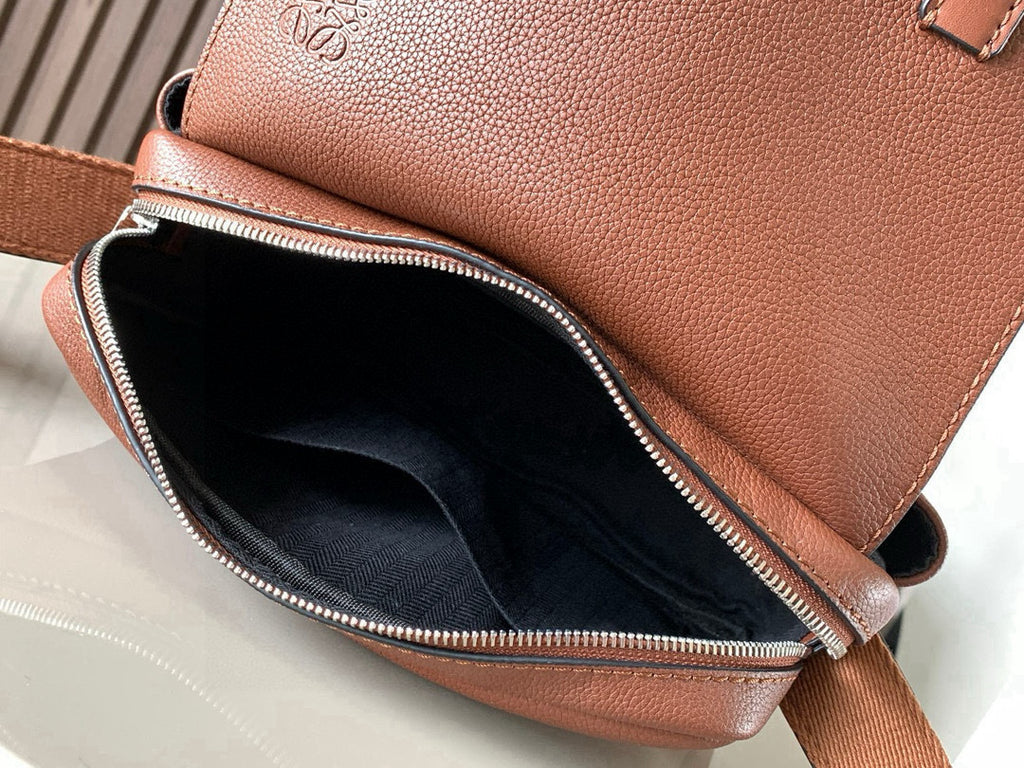 Loewe men's small leather bag interior with zippered opening and fabric lining