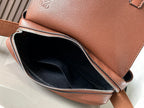 Leather bag open view with fabric-lined interior and zip closure