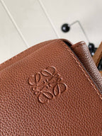 Loewe men's leather bag with embossed logo on front panel