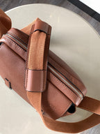 Loewe men's leather crossbody bag with zip pocket and adjustable strap