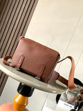 Loewe men's small leather crossbody bag with front flap and buckle straps
