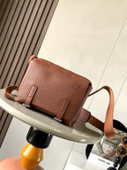 Loewe men's small leather crossbody bag with front flap and buckle straps
