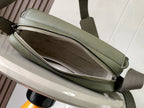 Sage green crossbody bag interior view with dual zipper tracks and fabric lining