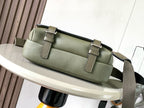 Sage green pebbled leather crossbody bag with front flap and two buckle details