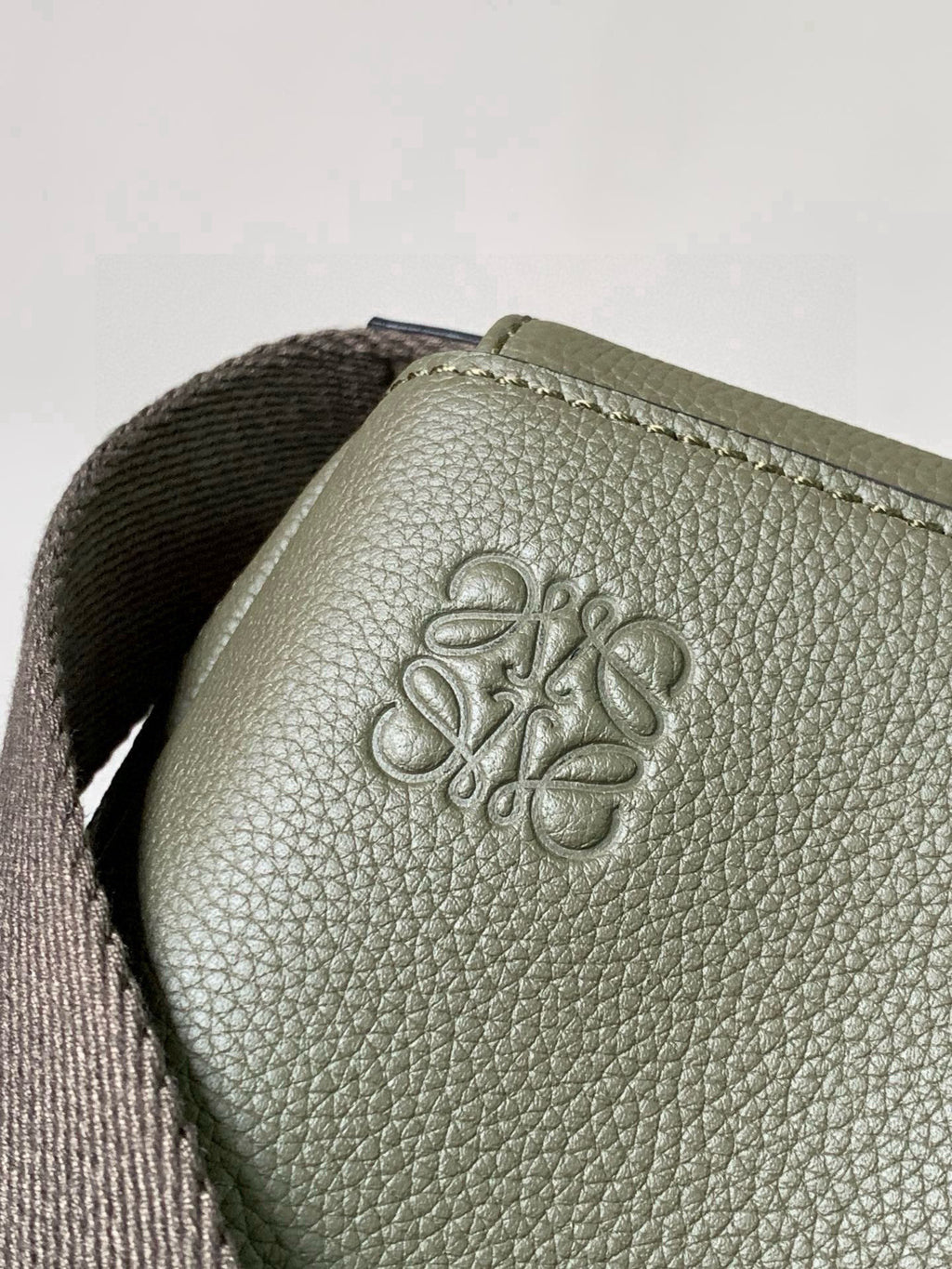 Loewe men bag logo emboss on olive textured leather