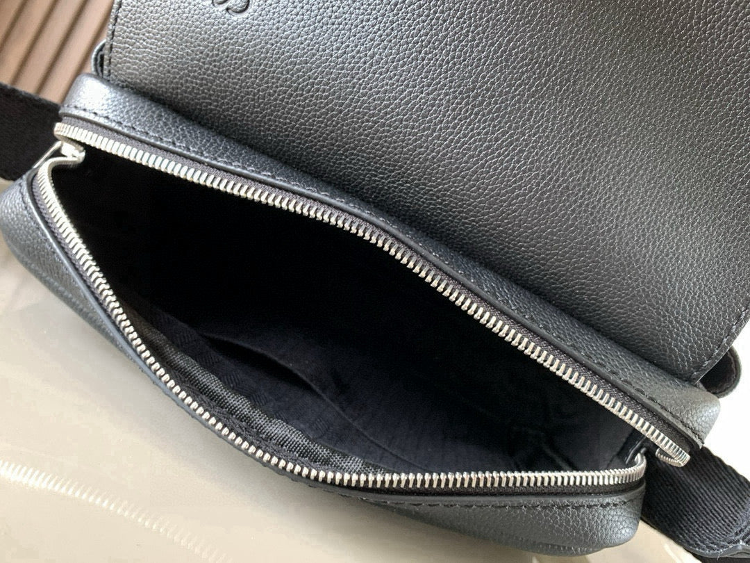 Loewe bag interior view: dark lined compartment with double zippers and zipper track.