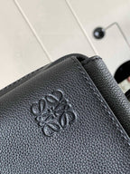 Embossed LOEWE logo on dark pebbled leather bag