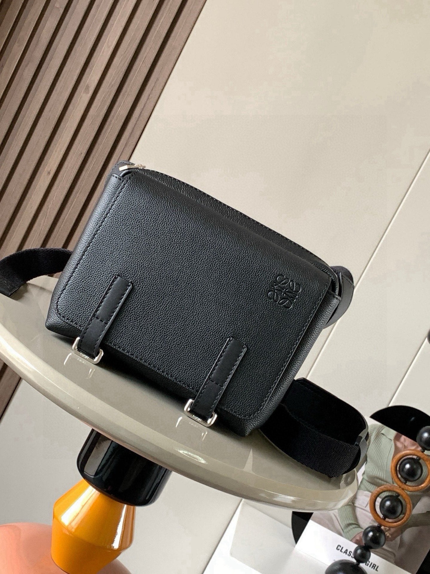 Loewe men's crossbody bag, dark textured leather, flap and adjustable strap