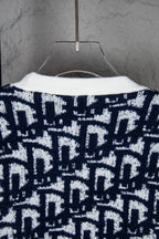 Knit cardigan back with navy-and-white geometric pattern and curved neckline