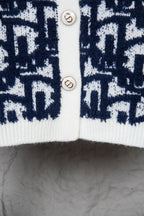 Dior long knit cardigan with navy patterned front and white button placket