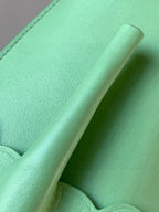 Loewe mint green leather strap and side panel with curved handle detail