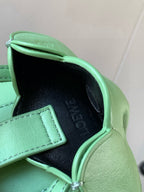 Loewe mint green leather mini bag with dark interior and stitched front pocket