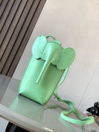 Loewe small mint green leather bag with top flap, front pocket, and short crossbody strap