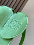 Loewe mint green leather heart-shaped flap with embossed logo and stitched edge