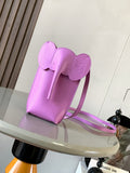 Loewe bag in lilac leather with top flap, short handle and crossbody strap