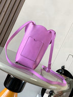 Loewe bag in lilac leather with long crossbody strap and scalloped top flap