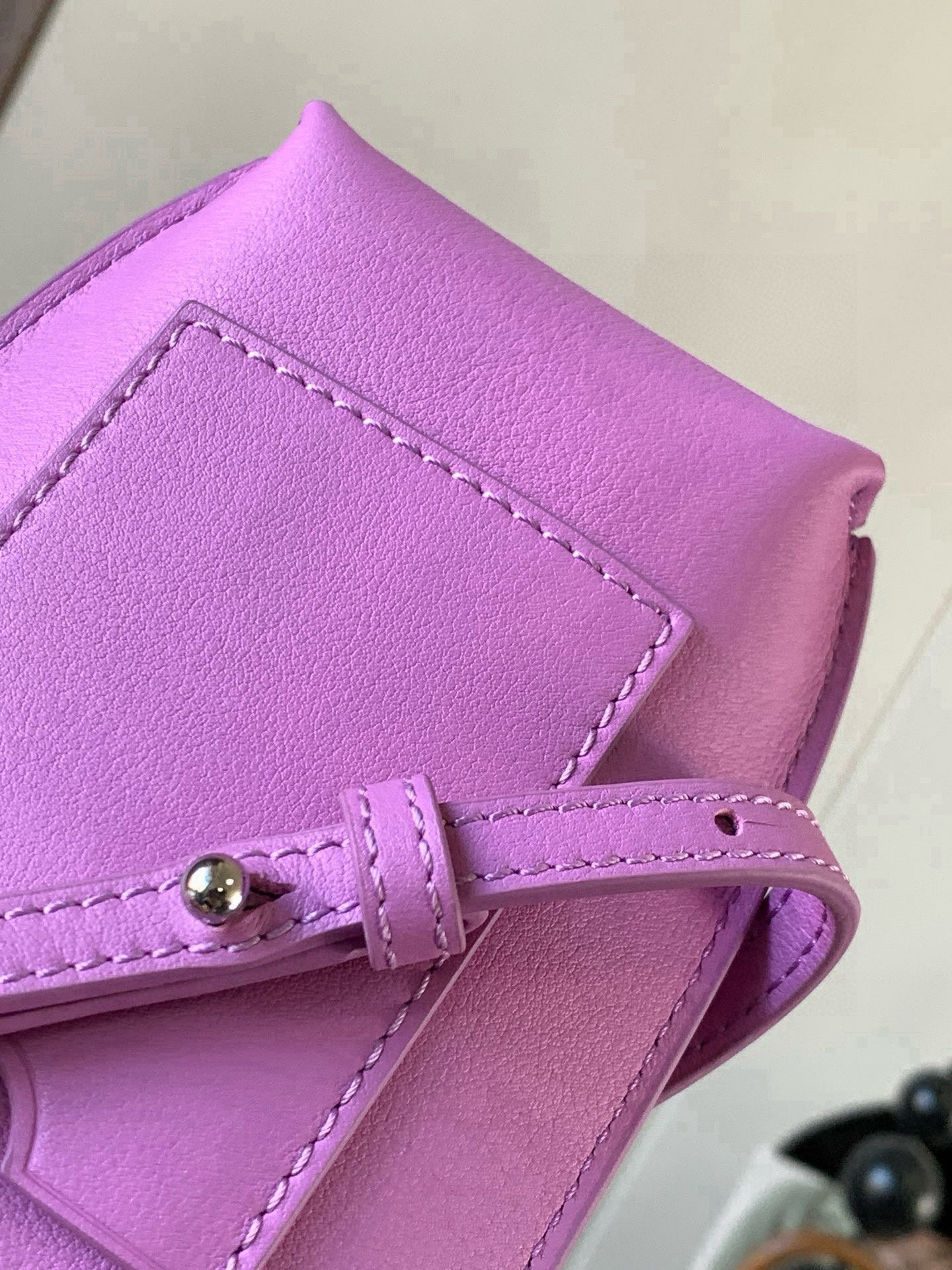 Loewe bag lilac leather corner detail with stitched panel and small metal clasp