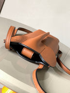 Loewe small leather crossbody bag, tan-brown, with front pocket and strap