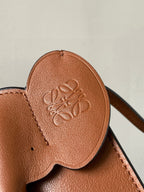Loewe leather bag flap with embossed logo, tan-brown
