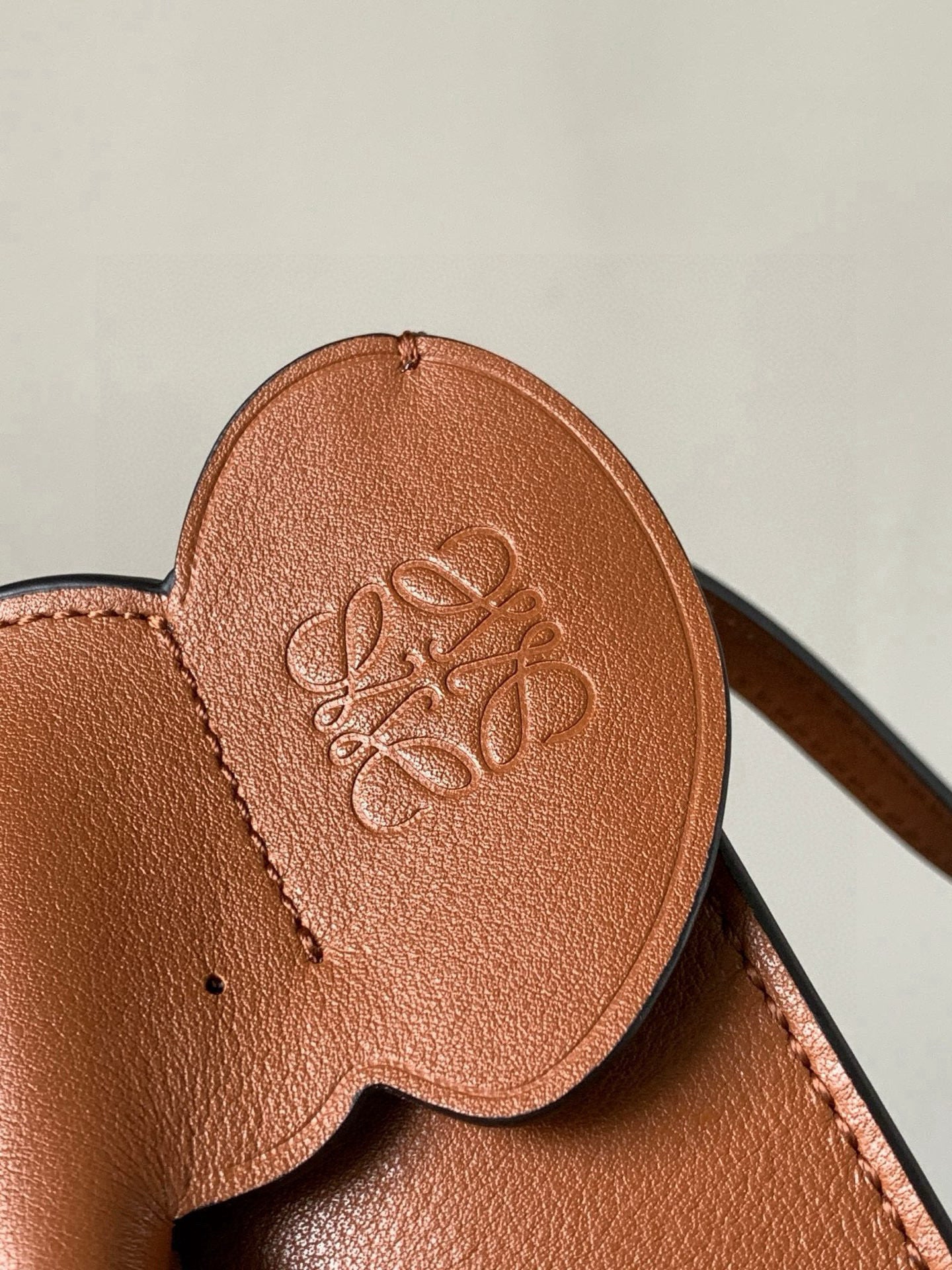 Loewe leather bag flap with embossed logo, tan-brown