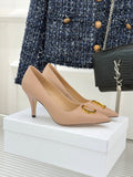 Beige Dior pointed-toe stiletto pumps with gold logo detail on the vamp