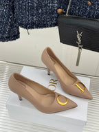 Beige Dior pointed-toe stiletto pumps pair with gold logo details, angled view
