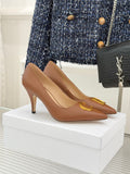 Dior ladies' tan pointed-toe pumps with slim heel and gold D emblem on vamp
