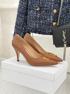 Dior ladies' tan pointed-toe pumps with slim heel and gold D emblem on vamp
