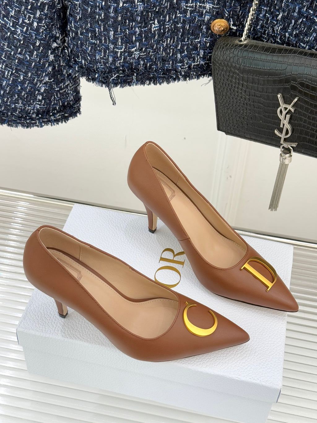 Dior ladies' tan pointed-toe pumps with slim heels and gold O emblem
