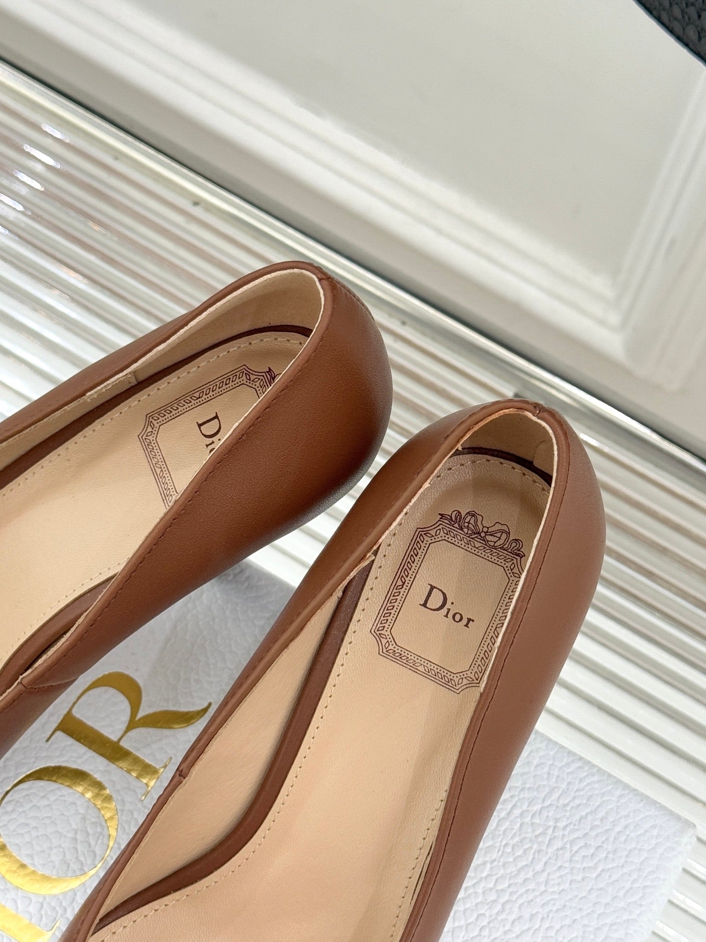 Dior ladies' tan leather pumps with beige insole and Dior logo label