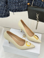 Cream pointed-toe high-heel pumps with gold C and D logo details