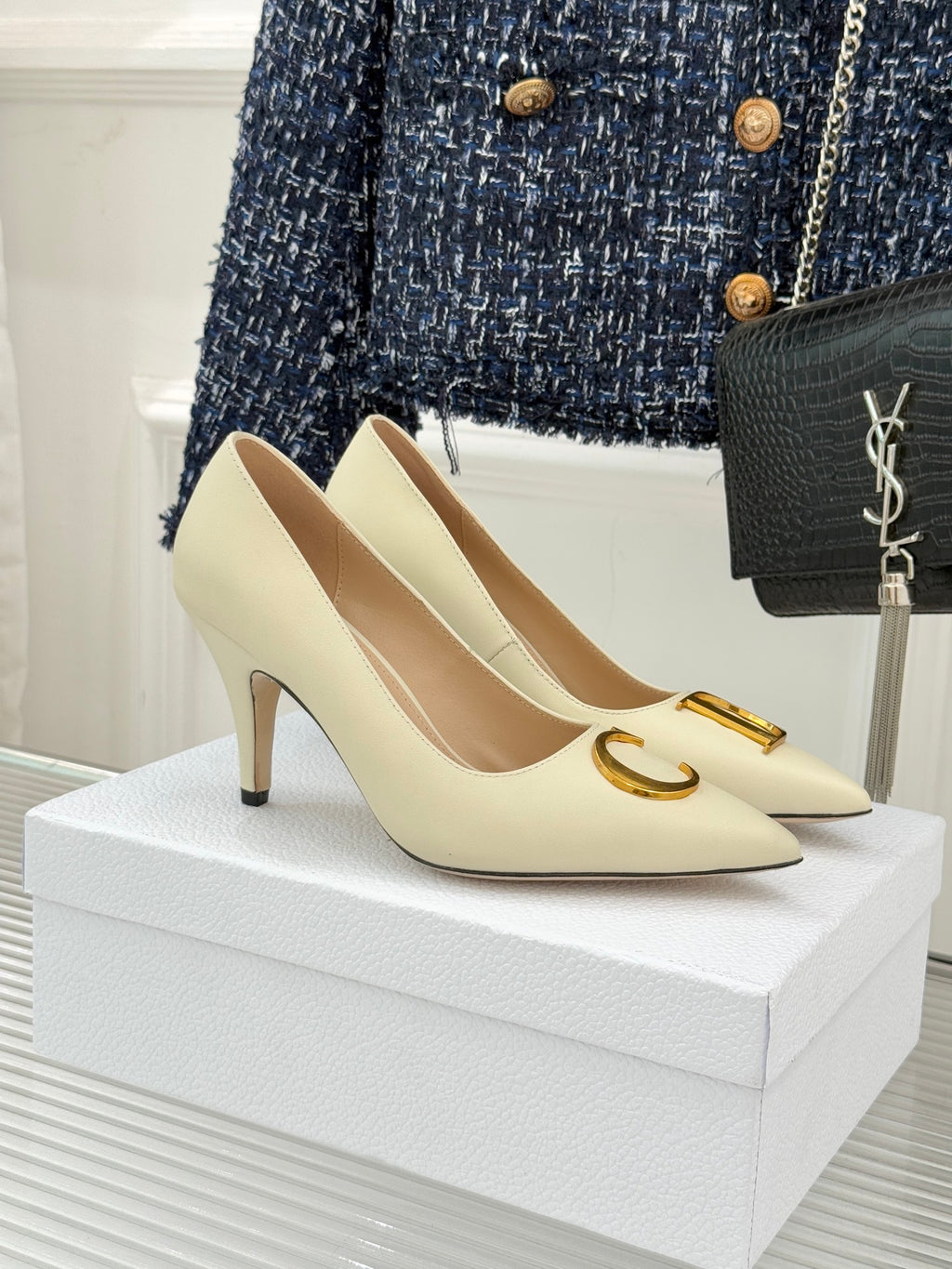 Cream pointed-toe high-heel pumps with gold D detail