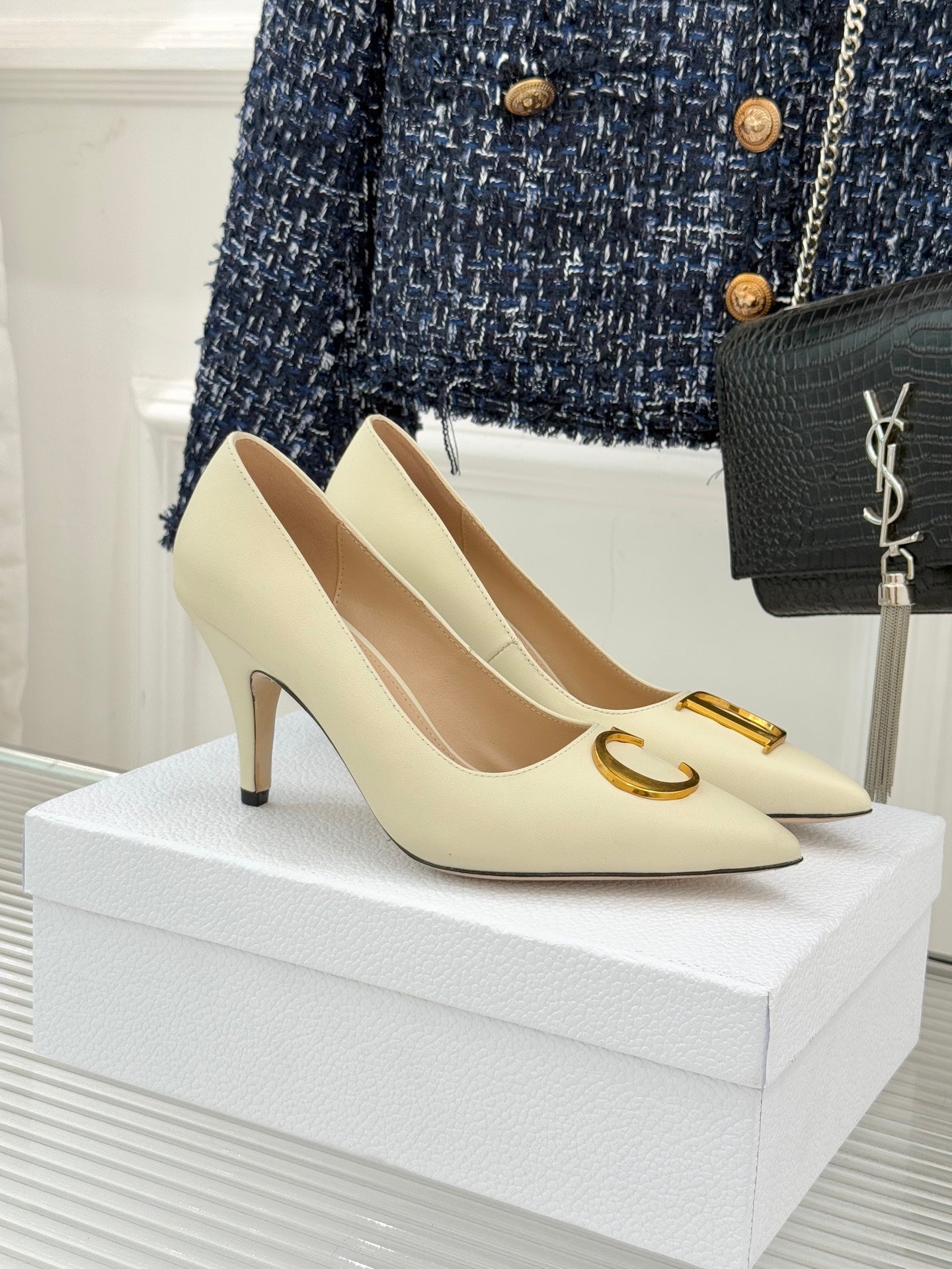 Cream pointed-toe high-heel pumps with gold D detail