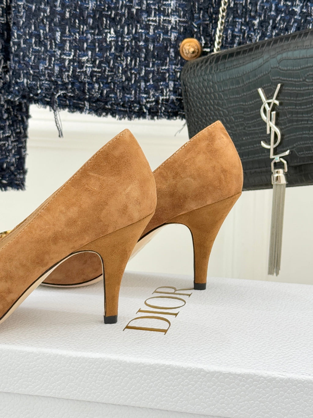 Tan suede pointed-toe stiletto pumps with sculpted heel and side cut detail