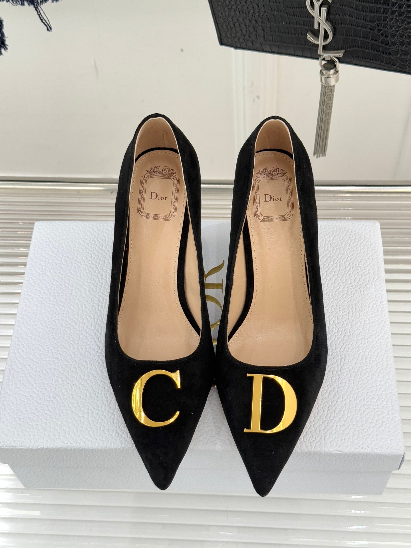 Black suede pointed pumps with Dior lettering on insoles