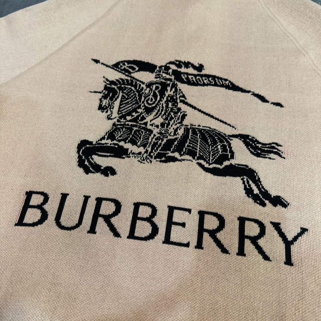 Beige fabric panel with black Burberry horse and lettering graphic