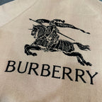 Beige fabric panel with black Burberry horse and lettering graphic